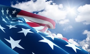 American flag closeup on blue sky American flag closeup on blue sky